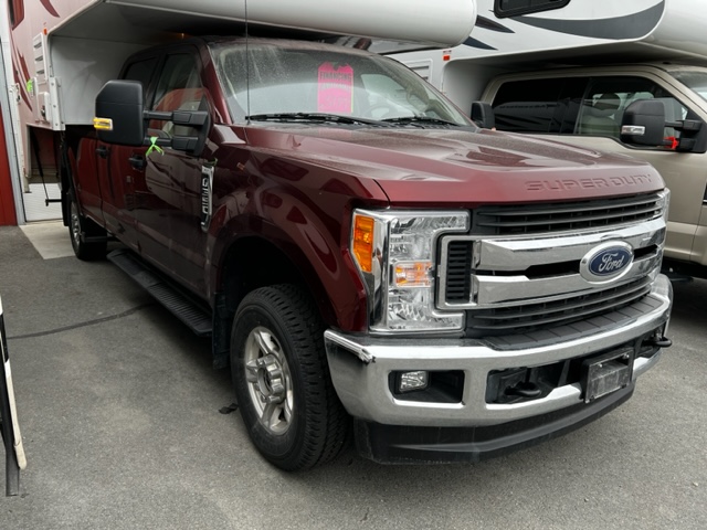 Red colored Ford super duty truck with crew cab
