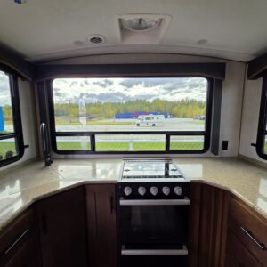 "Bright kitchen area with large windows."