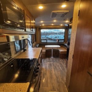 Inside view of a modern RV kitchen.