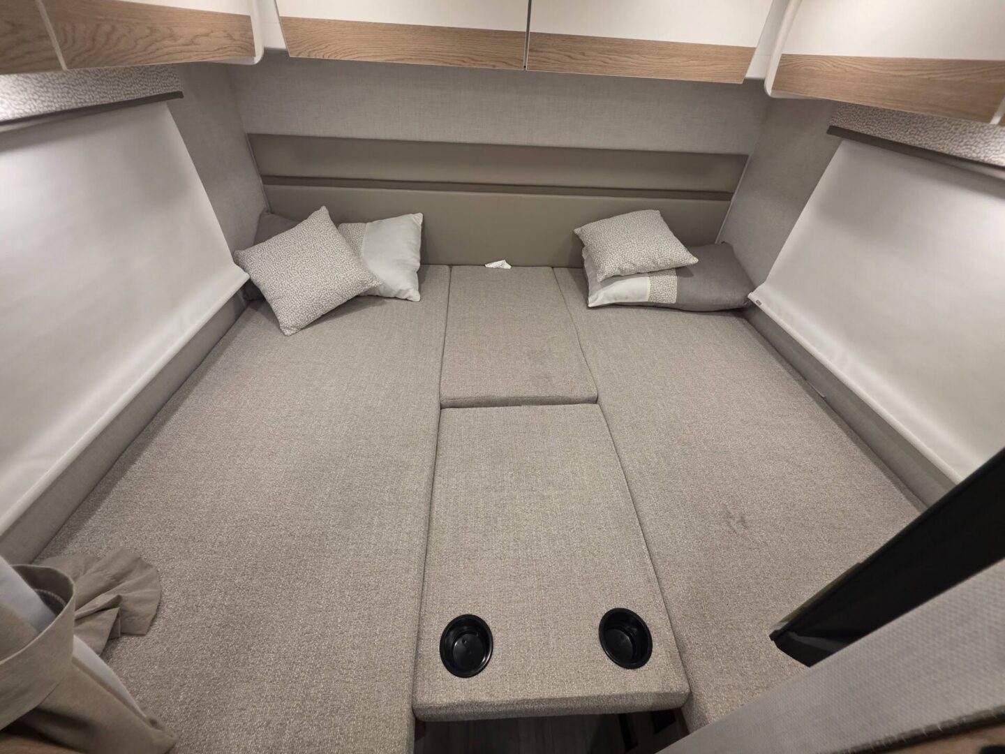 Cozy seating area with soft cushions and pillows.