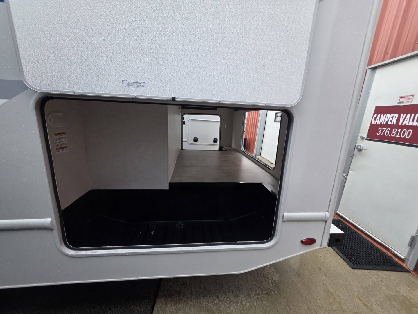 Open storage compartment of a travel trailer.