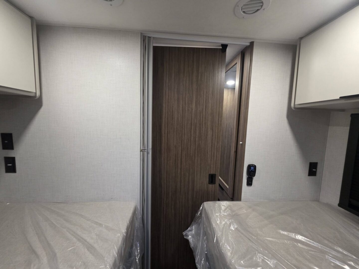 Interior view of camper with twin beds.