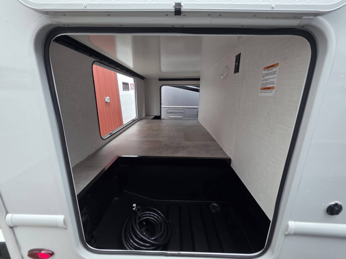 Open storage area in a travel trailer.