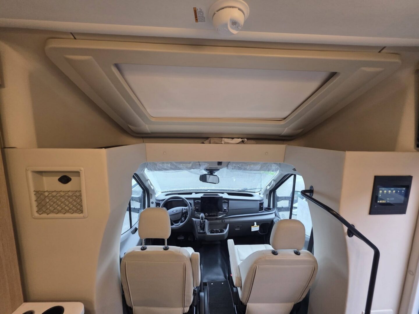 Interior view of a modern RV driver's area.