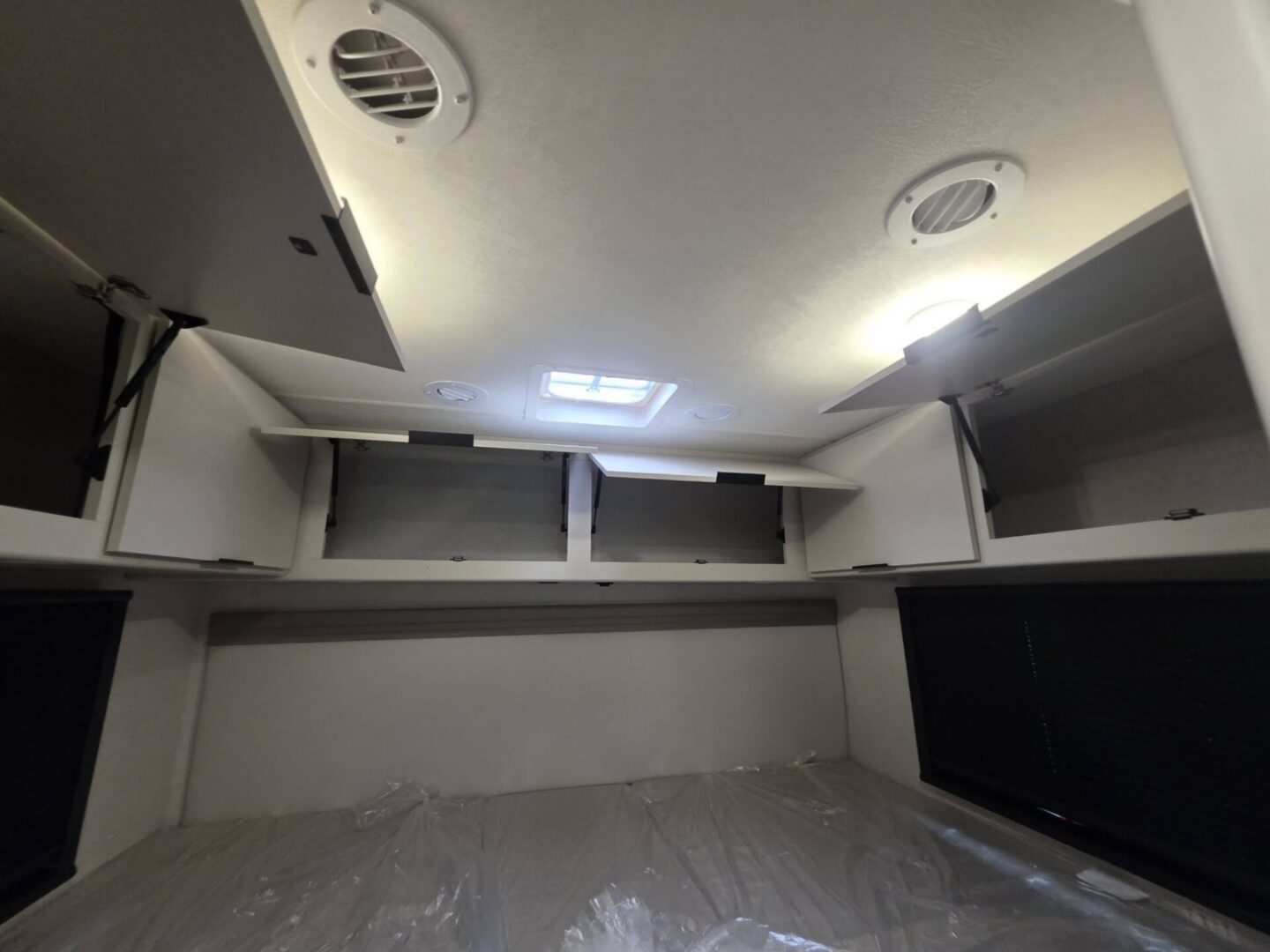 "Interior storage cabinets with overhead lighting."