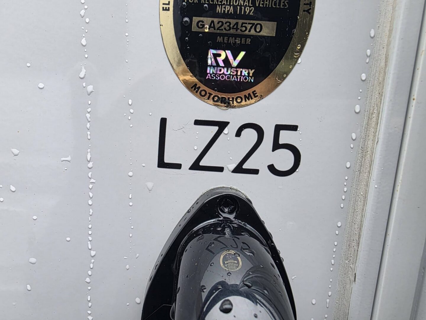 Close-up of RV identification label and connector.