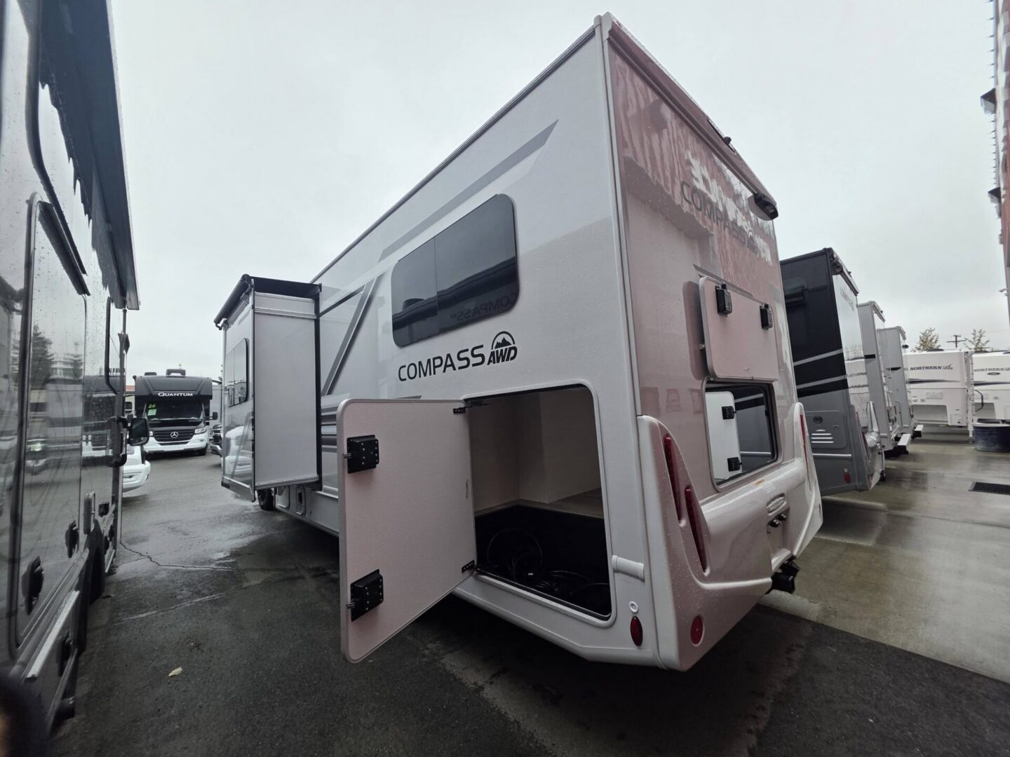 "Rear view of a Compass travel trailer."
