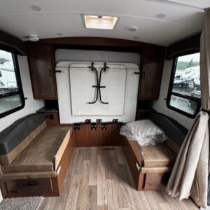 Cozy camper seating area with natural light.